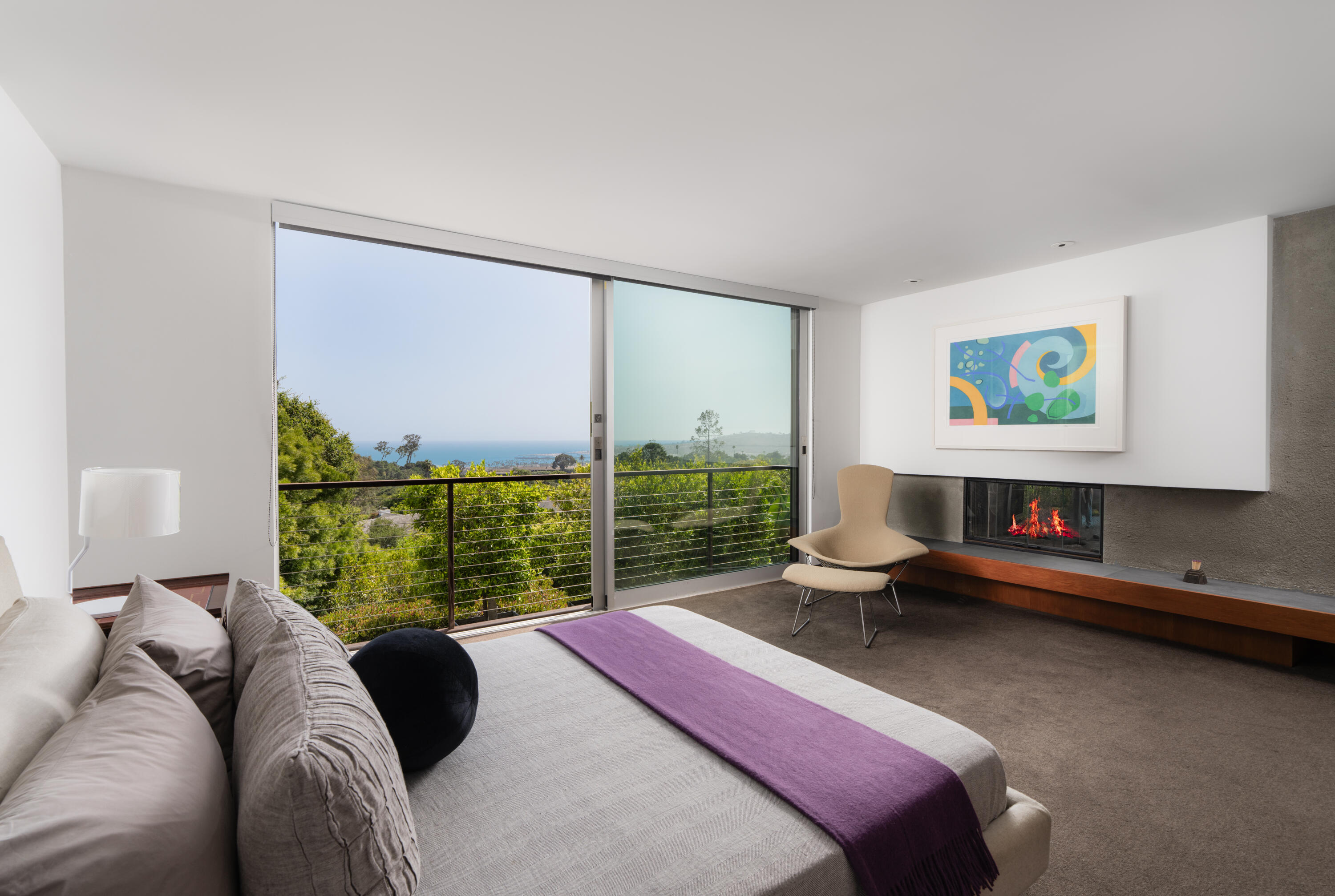 1944 Eucalyptus Hill Road Santa Barbara, CA 93108 - Photo 7 of 38 a bedroom with a bed and glass window