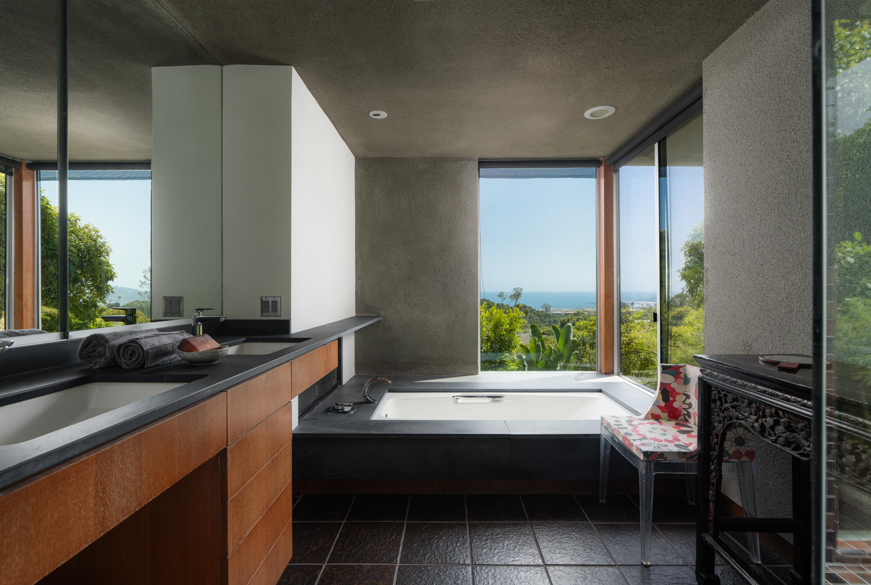 1944 Eucalyptus Hill Road Santa Barbara, CA 93108 - Photo 10 of 38 a room with a table chairs and window