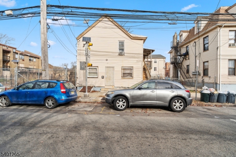 295 South 7th Street Newark, NJ 07103 - Photo 6 of 14 a car parked in front of a house