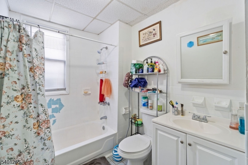 295 South 7th Street Newark, NJ 07103 - Photo 7 of 14 a bathroom with a sink toilet and shower