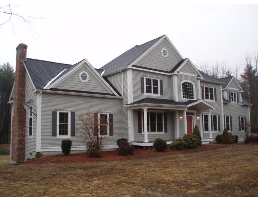 12 Collins Road Berlin, MA 01503 - Photo 1 of 14 a front view of a house with a yard