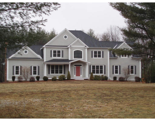 12 Collins Road Berlin, MA 01503 - Photo 2 of 14 a front view of a house with a yard