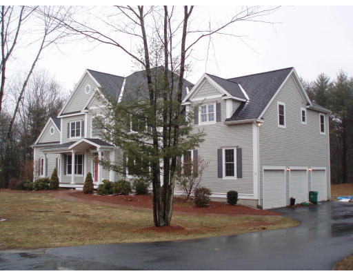 12 Collins Road Berlin, MA 01503 - Photo 3 of 14 a front view of a house with a yard