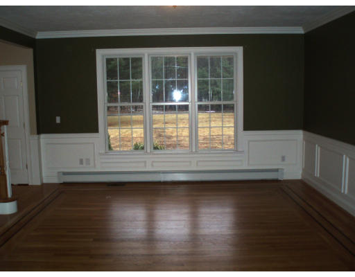 12 Collins Road Berlin, MA 01503 - Photo 8 of 14 a view of empty room with wooden floor and fan