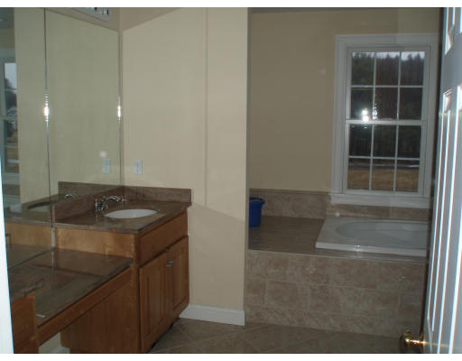 12 Collins Road Berlin, MA 01503 - Photo 10 of 14 a bathroom with a sink and a mirror