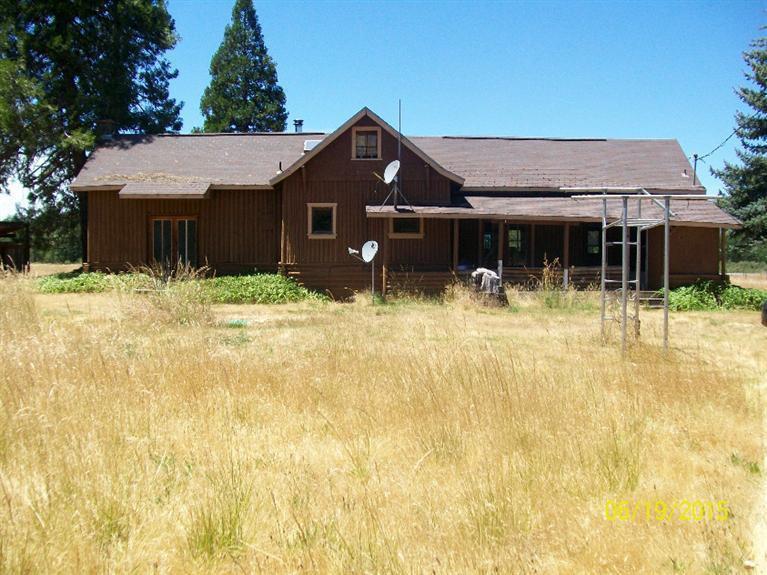 4271 Rockydale Road Cave Junction, OR 97523 - Photo 25 of 35 wide angle view of the back of the home.