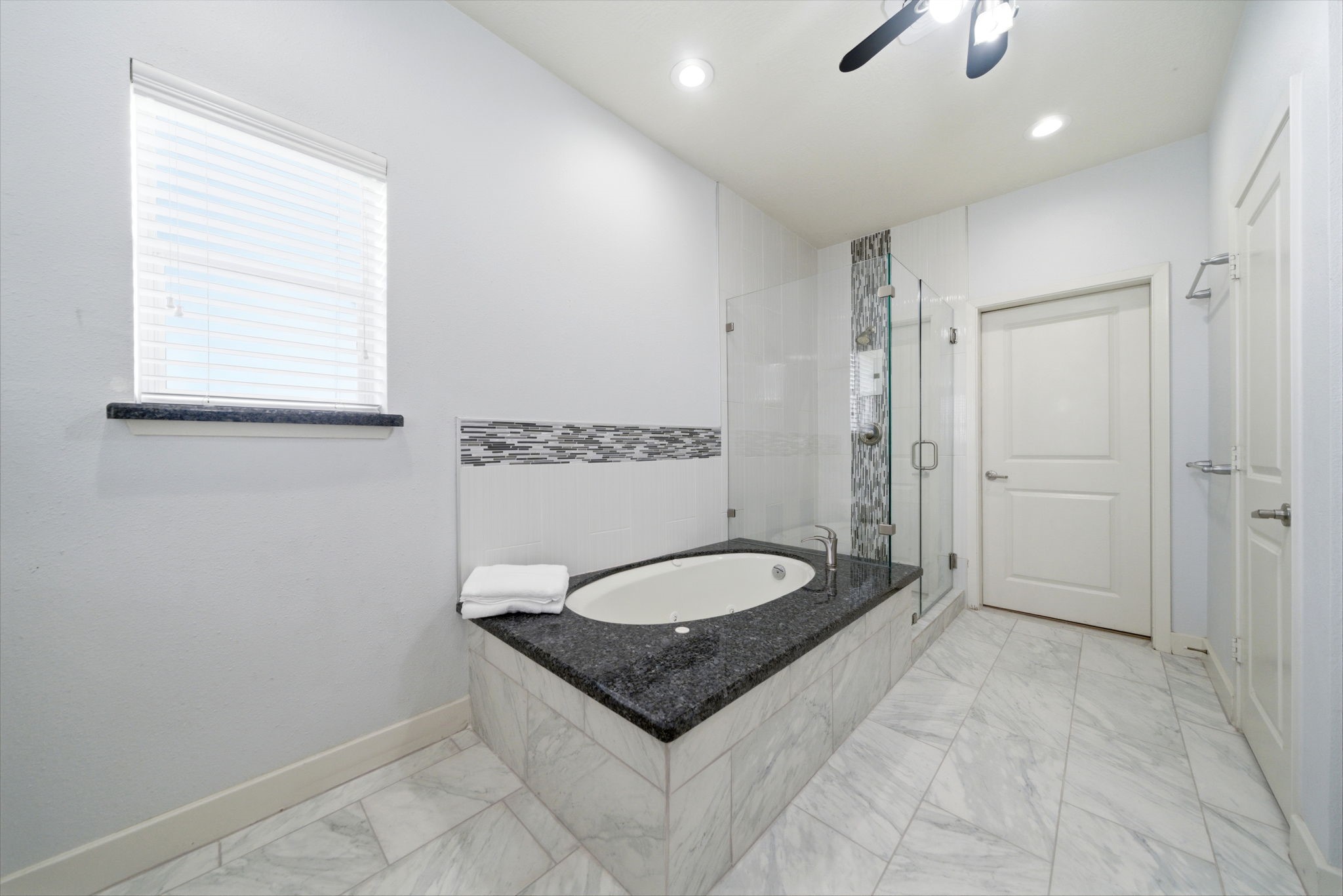1910 Fletcher Street Houston, TX 77009 - Photo 29 of 34 Large garden tub perfect for relaxing at the end of the day, separate walk-in shower and water closet.