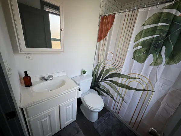a bathroom with a toilet and a sink