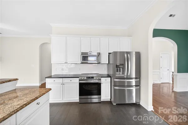a view of livingroom with hardwood floor and a ceiling fan