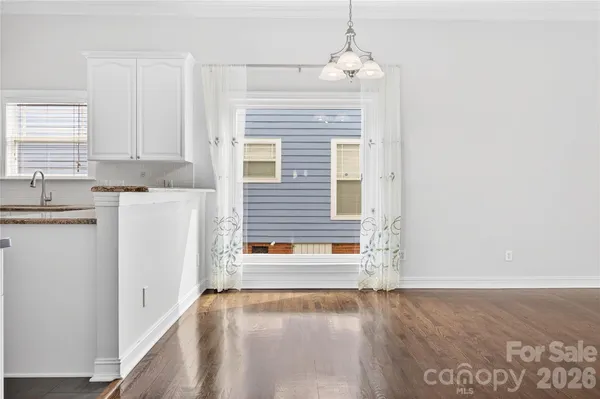 a bedroom with a large bed and a couch