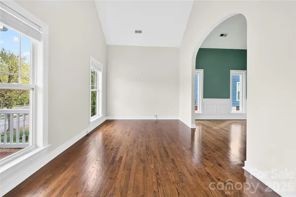 a view of living room with wooden floor and window