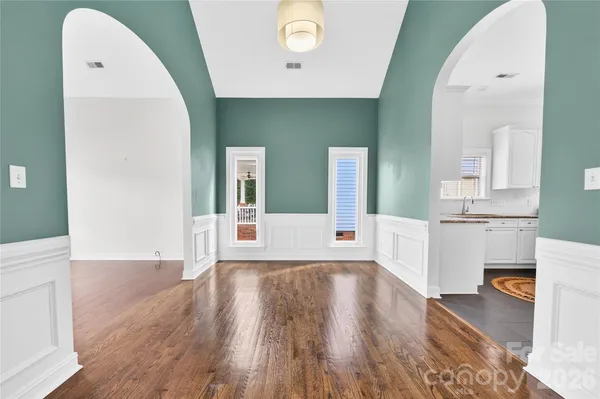 a kitchen with granite countertop a refrigerator stove and microwave