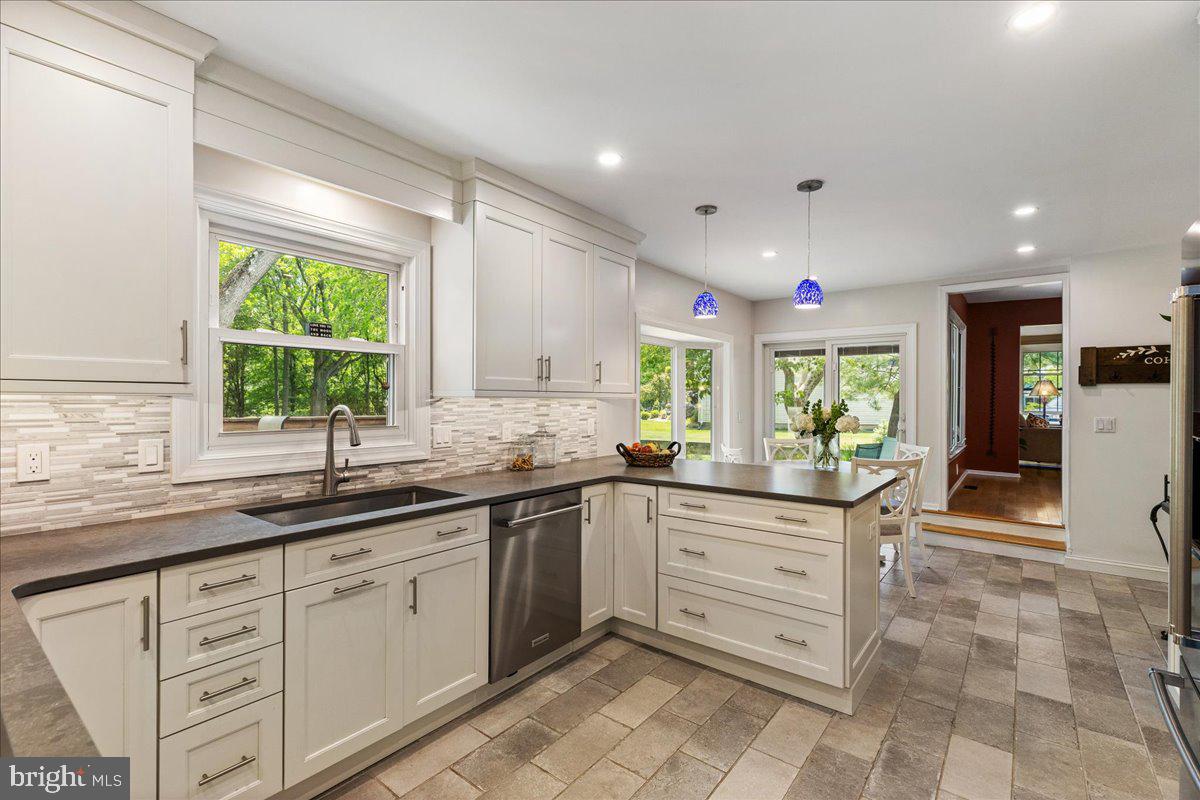 3 Strathmore Place Princeton Junction, NJ 08550 - Photo 8 of 29 a kitchen with a sink window and cabinets