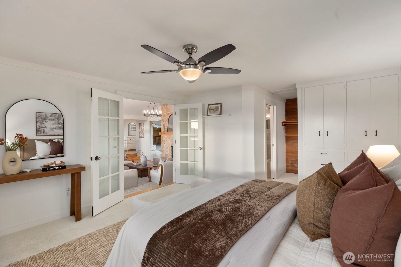 702 Rhodora Heights Road Lake Stevens, WA 98258 - Photo 22 of 40 a bedroom with a bed and ceiling fan