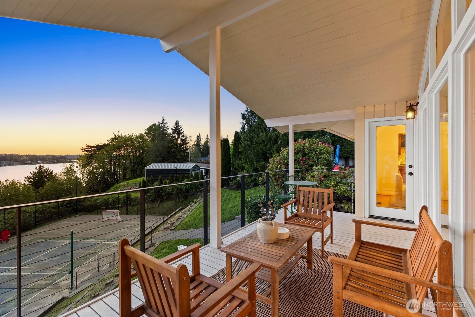 702 Rhodora Heights Road Lake Stevens, WA 98258 - Photo 10 of 40 a view of a chairs and table in the balcony
