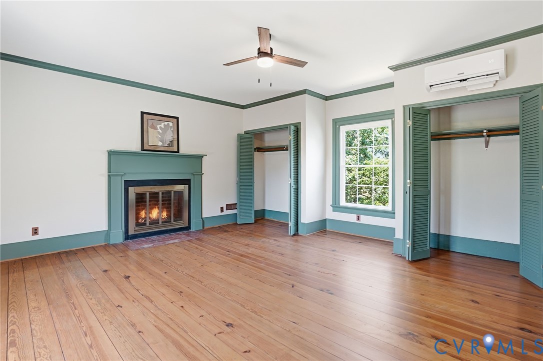 2297 Indian Oak Road Crewe, VA 23930 - Photo 33 of 53 wooden floor fireplace and windows in an empty room