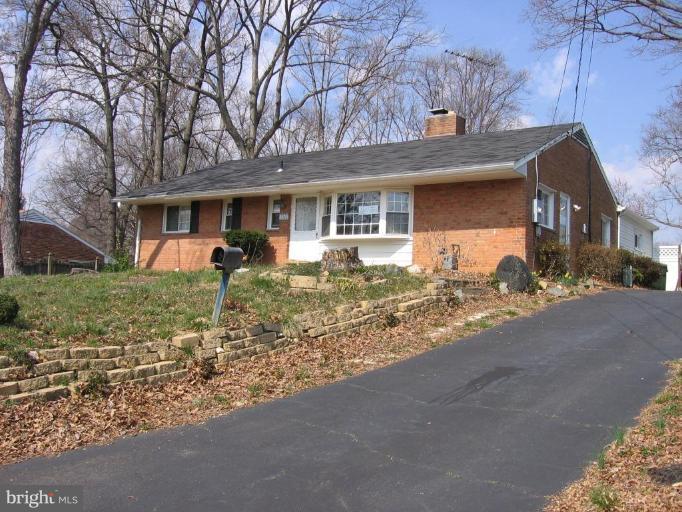 7310 Old Keene Mill Road Springfield, VA 22150 - Photo 1 of 30 front view of a house with a yard