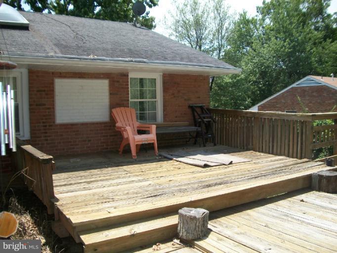 7310 Old Keene Mill Road Springfield, VA 22150 - Photo 13 of 30 a wooden bench sitting on top of a wooden floor