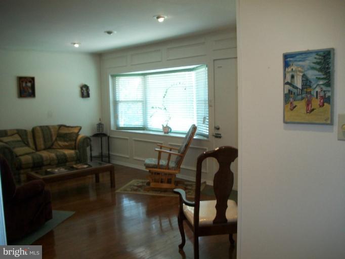 7310 Old Keene Mill Road Springfield, VA 22150 - Photo 19 of 30 a living room with furniture and a large window