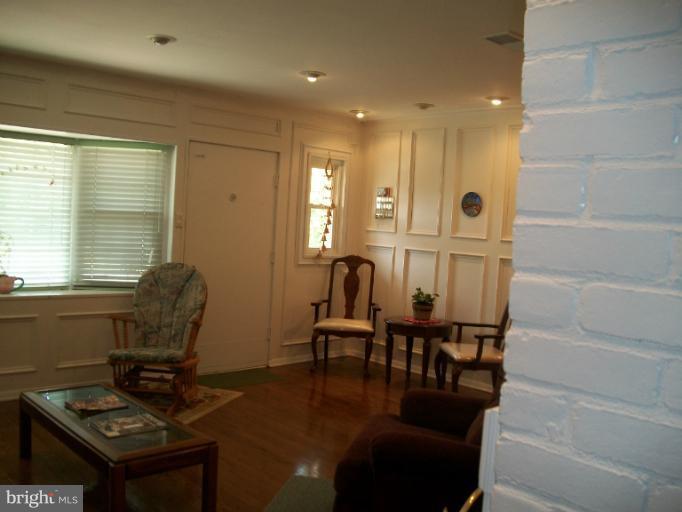 7310 Old Keene Mill Road Springfield, VA 22150 - Photo 22 of 30 a dining room with furniture and wooden floor