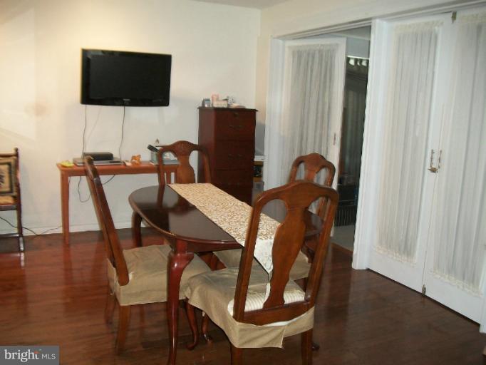 7310 Old Keene Mill Road Springfield, VA 22150 - Photo 23 of 30 a view of a dining room with furniture and wooden floor