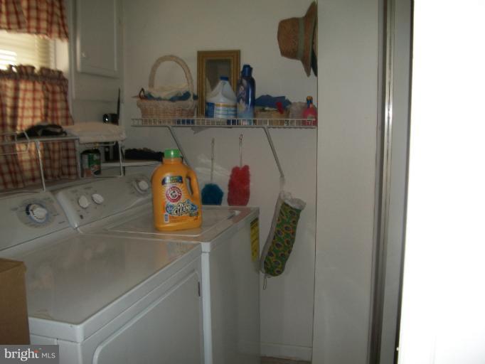 7310 Old Keene Mill Road Springfield, VA 22150 - Photo 27 of 30 a bathroom with a sink and mirror