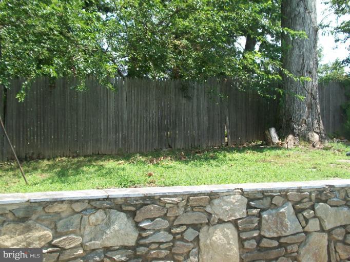 7310 Old Keene Mill Road Springfield, VA 22150 - Photo 5 of 30 a garden with trees in front of it