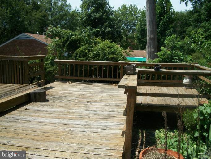 7310 Old Keene Mill Road Springfield, VA 22150 - Photo 6 of 30 a view of balcony with wooden floor and outdoor seating