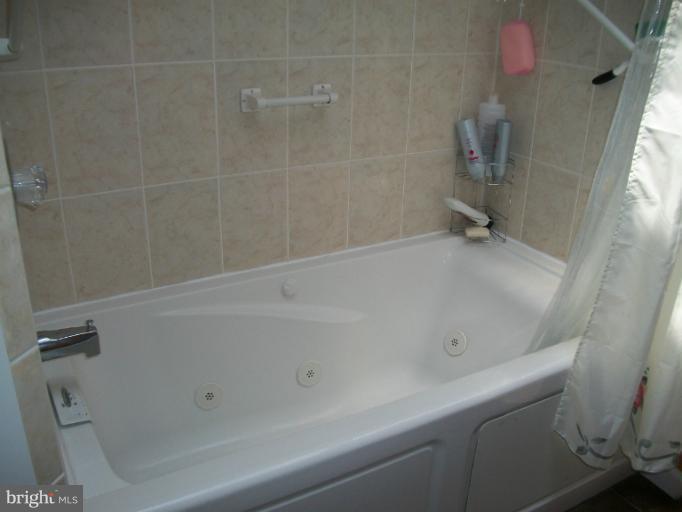 7310 Old Keene Mill Road Springfield, VA 22150 - Photo 10 of 30 a close up of a bathtub
