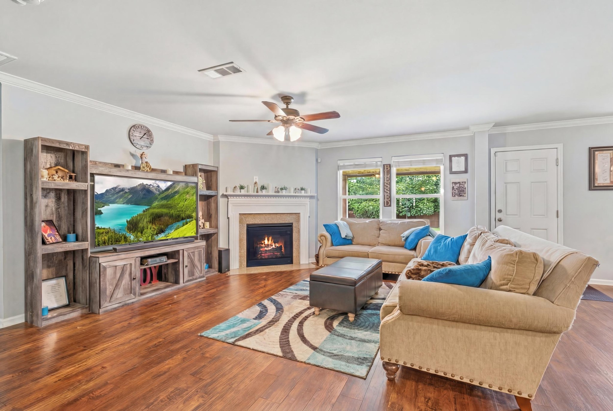 1011 Benwick Road Hendersonville, TN 37075 - Photo 20 of 60 a living room with furniture a flat screen tv and a fireplace