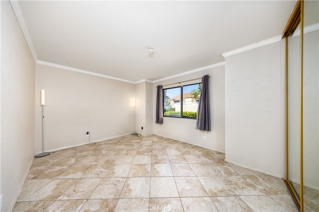 21 Country Mile Road Pomona, CA 91766 - Photo 12 of 18 a view of an empty room with window and closet area