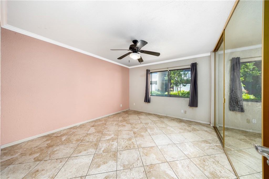 21 Country Mile Road Pomona, CA 91766 - Photo 14 of 18 a view of an empty room and window and chandelier fan