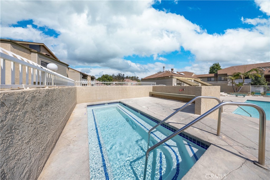 21 Country Mile Road Pomona, CA 91766 - Photo 18 of 18 a view of a balcony with two chairs and a potted plant