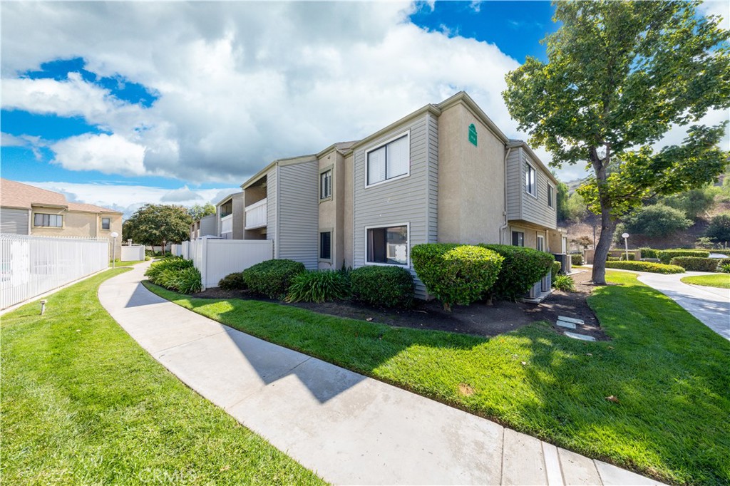 21 Country Mile Road Pomona, CA 91766 - Photo 2 of 18 a front view of a house with garden