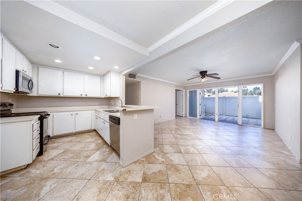 21 Country Mile Road Pomona, CA 91766 - Photo 7 of 18 a large kitchen with a large counter top and appliances
