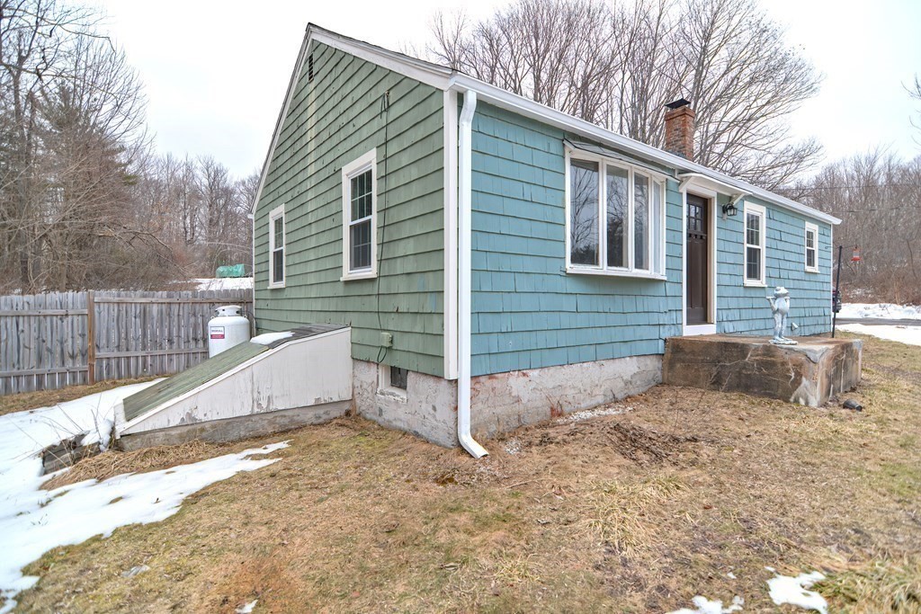 525 Patriots Road Templeton, MA 01468 - Photo 4 of 26 a view of a house with a yard and large tree