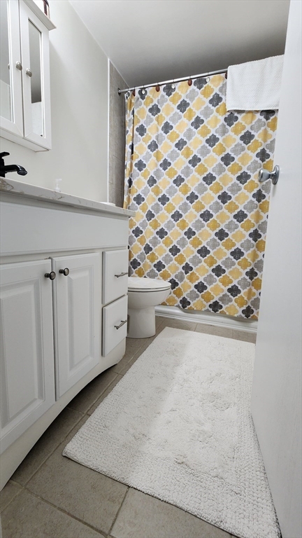 157 Franklin Street, Unit D1 Stoneham, MA 02180 - Photo 14 of 16 a view of a refrigerator cabinet