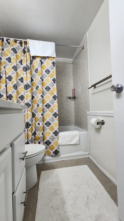 157 Franklin Street, Unit D1 Stoneham, MA 02180 - Photo 15 of 16 a bathroom with a sink toilet and shower