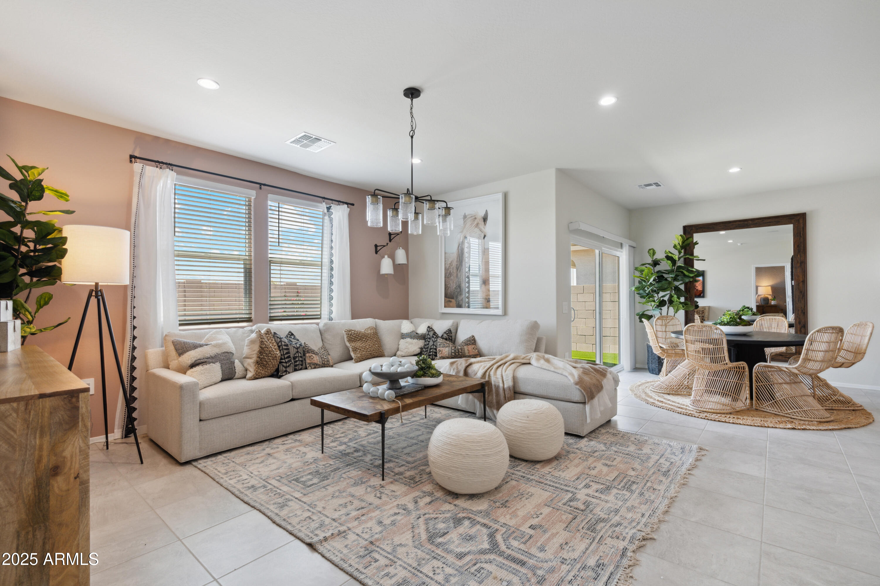 1426 East Bealey Avenue Coolidge, AZ 85128 - Photo 7 of 27 a living room with furniture and a chandelier