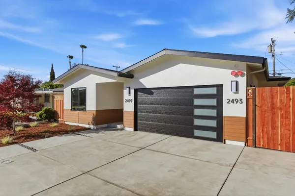 a front view of a house with a garage