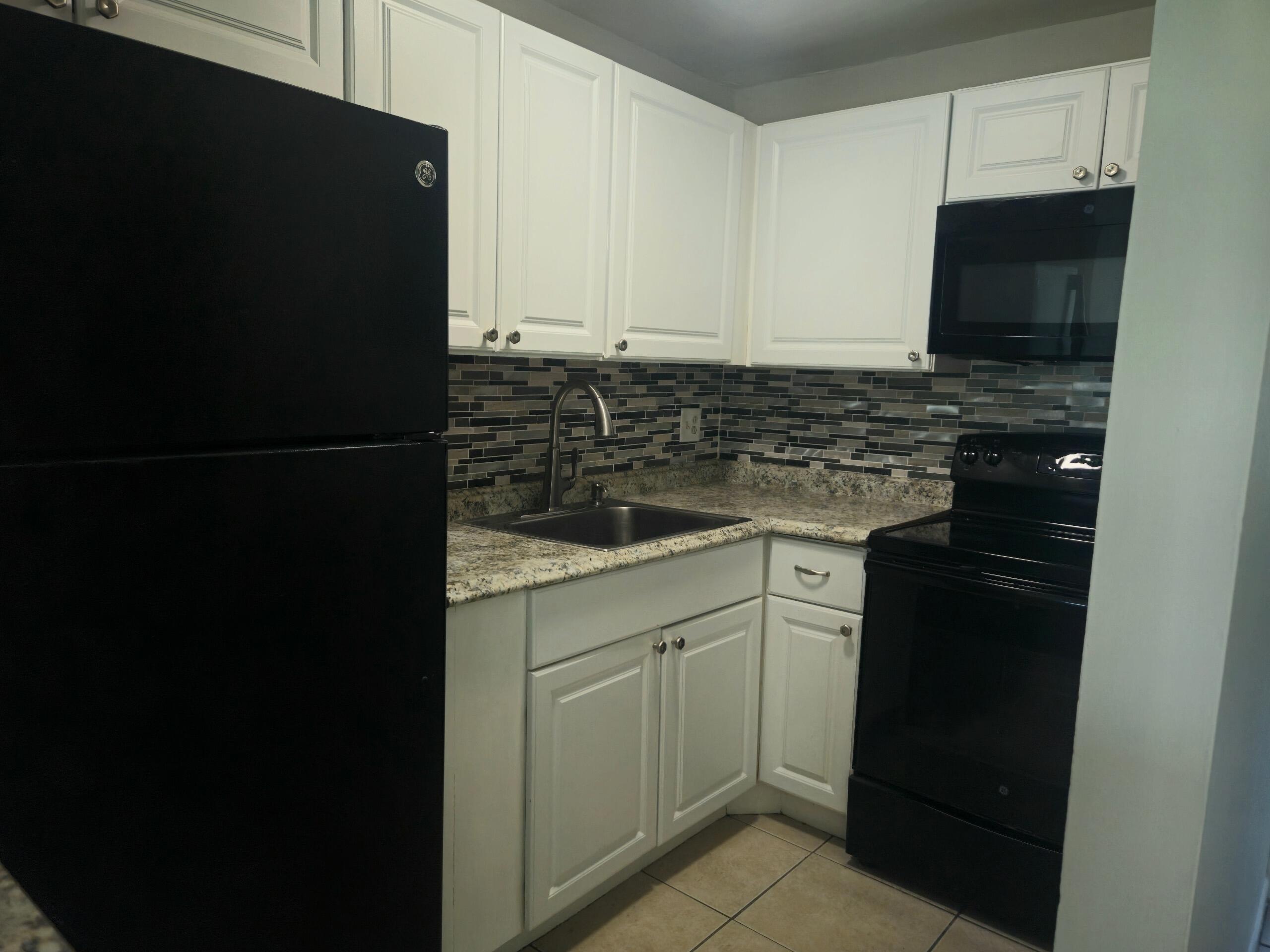 541 Northeast 48th Street, Unit 203 Boca Raton, FL 33431 - Photo 2 of 8 Resized_20260611_114543