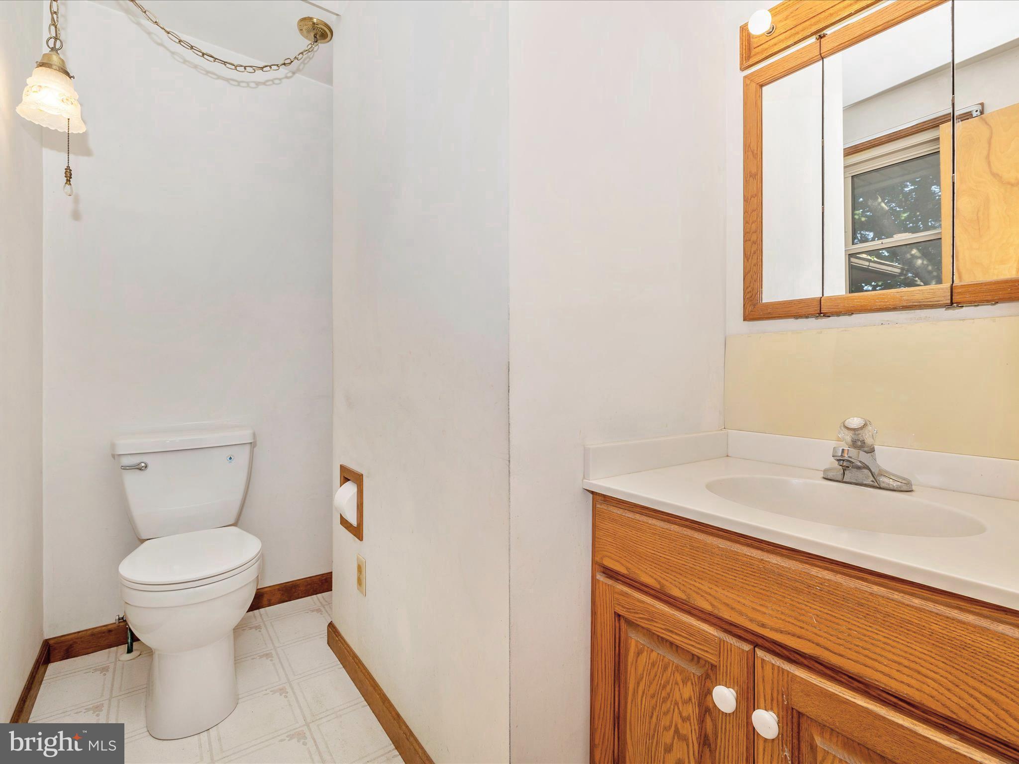 3300 Harney Road Taneytown, MD 21787 - Photo 23 of 37 a bathroom with a sink and a toilet