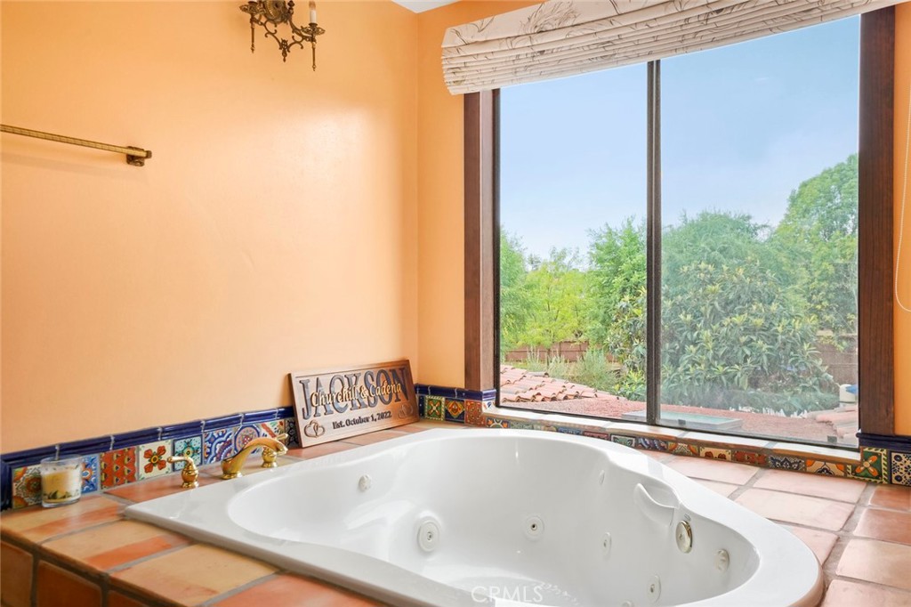 11550 Old Castle Road Valley Center, CA 92082 - Photo 27 of 74 a bathroom with a bathtub and next to a window