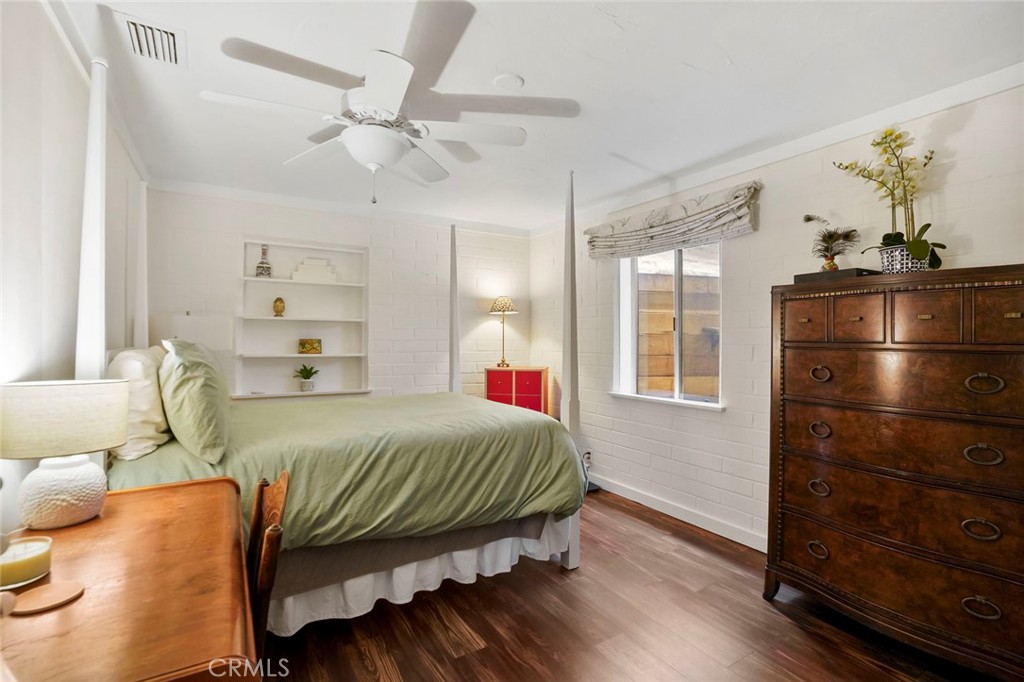 11550 Old Castle Road Valley Center, CA 92082 - Photo 36 of 74 a bedroom with a bed and wooden floor