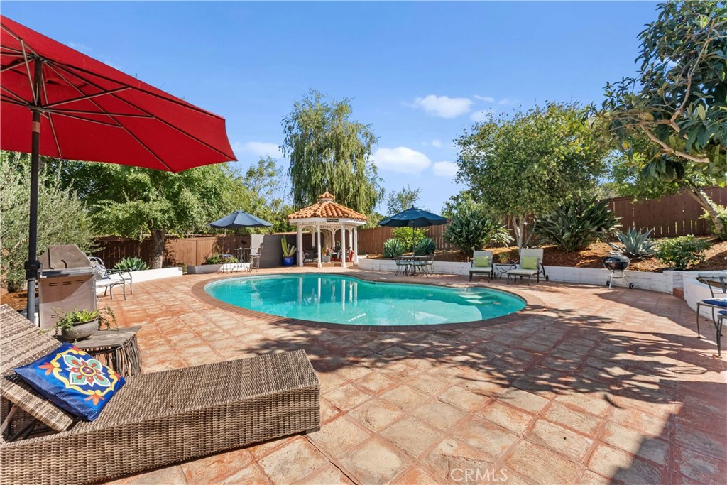 11550 Old Castle Road Valley Center, CA 92082 - Photo 66 of 74 a view of a backyard with plants and outdoor seating