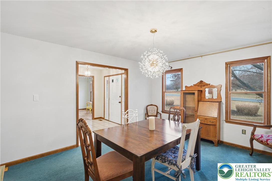 2160 Kecks Road Fogelsville, PA 18051 - Photo 23 of 58 a view of a dining room with furniture and chandelier