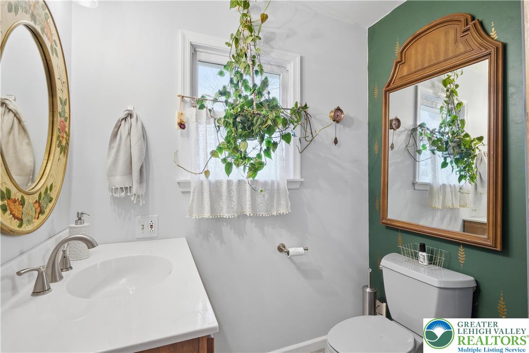 2160 Kecks Road Fogelsville, PA 18051 - Photo 33 of 58 a bathroom with a sink toilet and mirror