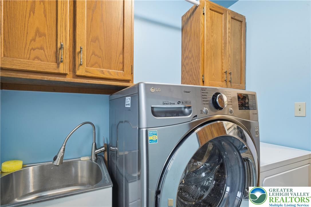 2160 Kecks Road Fogelsville, PA 18051 - Photo 36 of 58 a bathroom with a sink a washer and dryer