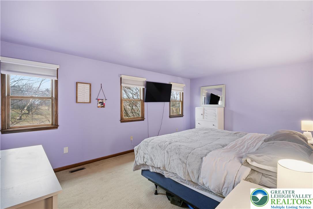 2160 Kecks Road Fogelsville, PA 18051 - Photo 41 of 58 a bedroom with a bed and a wall painting