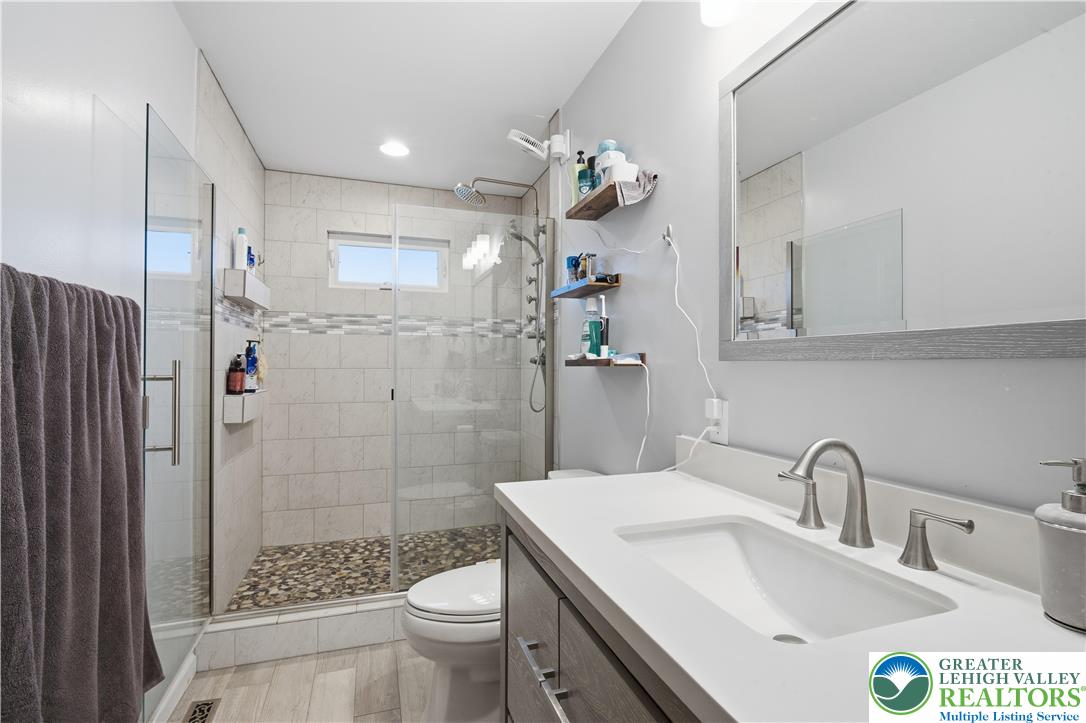 2160 Kecks Road Fogelsville, PA 18051 - Photo 44 of 58 a bathroom with a sink a toilet and shower